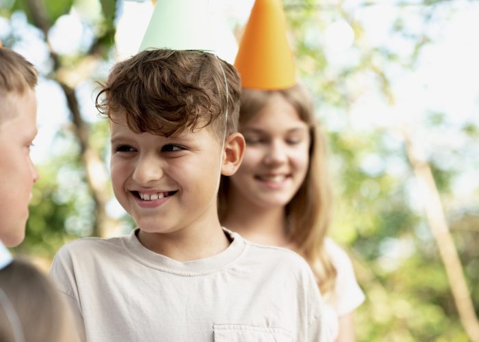close-up-smiley-kids-with-party-hats
